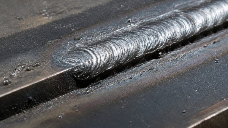 groove eroded along weld